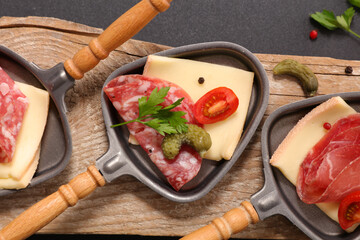 raclette cheese in spoon- top view
