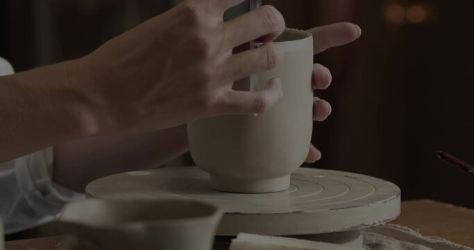 Professional Potter Shaping A Clay Cup