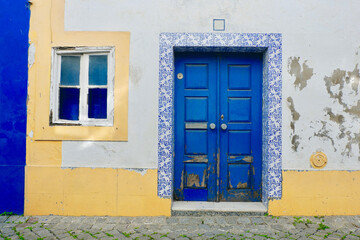 Fototapeta na wymiar Shabby entrance to authentic vintage house in Arronches, rural area of Serra de Sao Mamede, Portalegre district, Portugal