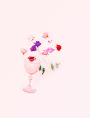 Crystal Art Deco glass and colorful flowers soaked in milky liquid, Minimal, creative summer party layout
