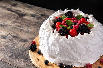 Delicious Pavlova cake with meringue topped and fresh berries.Copy space