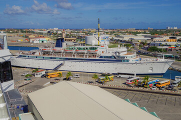 Classic luxury cruiseship or cruise ship liner Freewinds in Port of Oranjestad, Aruba with Yacht...