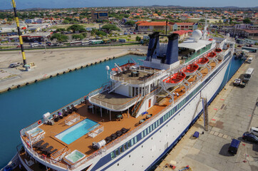 Classic luxury cruiseship or cruise ship liner Freewinds in Port of Oranjestad, Aruba with Yacht...