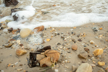 Fototapeta na wymiar Bathtime for the beach pebbles
