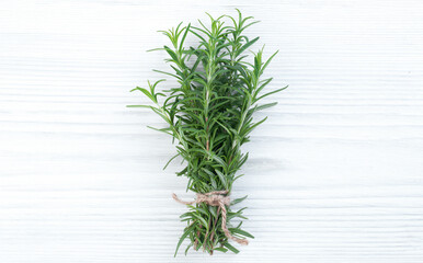 Bunches of fresh italian herbs tied with rope