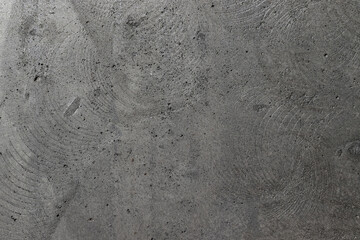 Gray, rough, concrete background texture. Stone wall with holes and various splashes