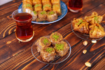 Turkish sweet baklava with Turkish tea on wooden background