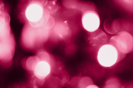 Blurred lights pink background. Abstract bokeh with soft light. Trendy color