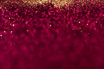 Pink and golden sparkling glitter bokeh background, christmas abstract defocused texture. Holiday lights