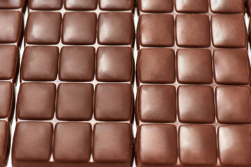 Close up shot of many sweet delicious chocolate bars pattern isolated