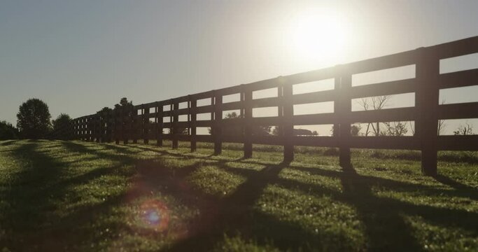 Backlit wooden agricultural fence 
