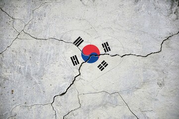 The symbol of the national flag Republic of Korea in the form of a heart on a cracked concrete wall.