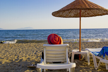young woman resting on the beach in summer