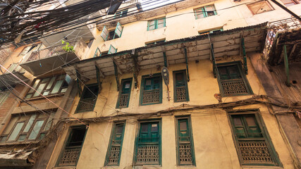 Old traditional wooden windows a in small street in Kathmandu, Nepal