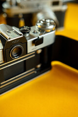 Vintage Photo Camera on yellow background