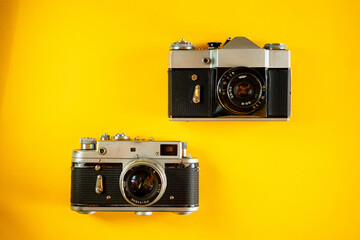 Vintage Photo Camera on yellow background