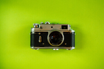 Vintage Photo Camera on green background