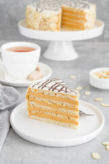 Traditional Esterhazy cake with almonds and pralines on a gray concrete background. Selective focus. Copy space.