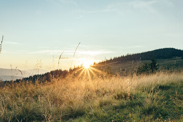 hiking in the mountains. sunset over mountain peaks. summer vacation