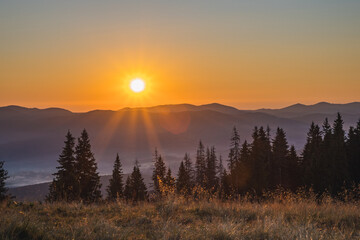 the sun rises over the mountain peaks. vacation in the mountains