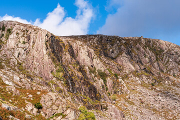 Fototapeta na wymiar Rock wall used by climbers in Glendalough, Wicklow Mountains, also known as Twin Buttress.