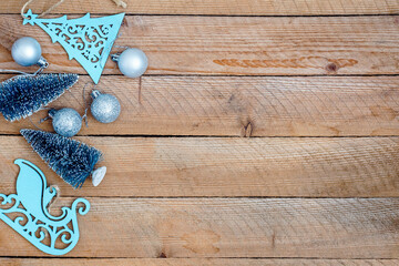 Christmas decorations on wooden background with advertising space