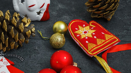 Christmas decorations in red gold color on black background