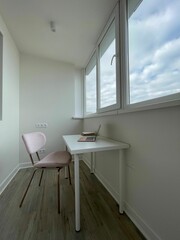 Vertical shot of home workspace near big window