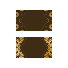 Business card template in brown color with Greek gold ornaments for your business.