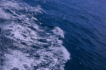 Beautiful white waves in dark blue sea