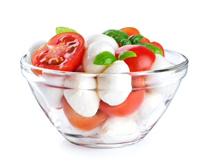Salad with mozzarella cheese, fresh tomatoes and basil isolated on white background. With clipping path.