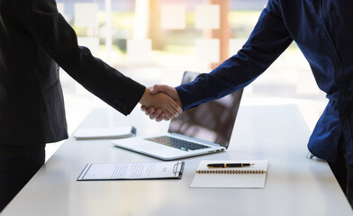 Business people shaking hands in the office.