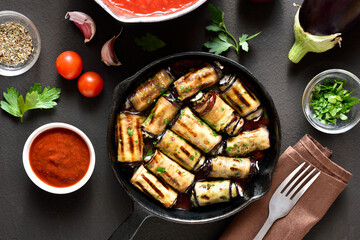 Eggplant (aubergine) rolls with cheese and greens