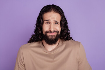 Photo of unhappy disappointed young man bad mood problem dilemma isolated on violet color background