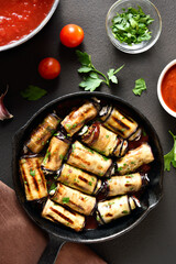 Eggplant (aubergine) rolls with cheese and greens