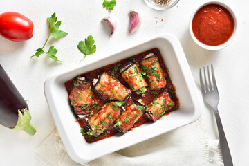 Baked eggplant rolls with tomato sauce and cheese