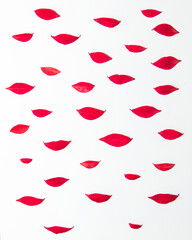 Autumn kisses idea. Red leaves on white background. Fall concept. Nature flat lay composition.