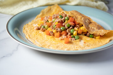 Stuffed Omelette, pork and carrots, corn, green peas, Thai food