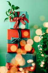 Christmas gift boxes with bokeh, red and green tones