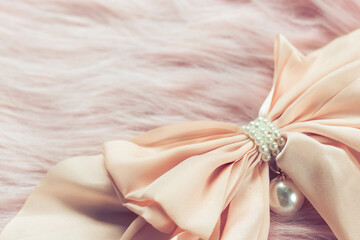 Luxury hair clip on pink fabric with copyspace.