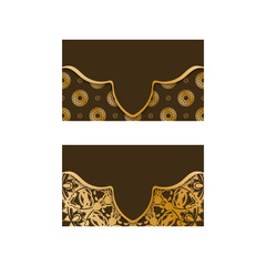 Business card in brown color with luxurious gold ornaments for your contacts.