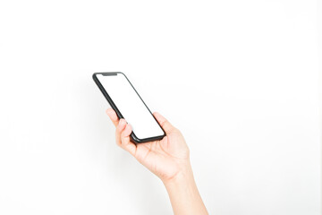 a hand holding a smartphone like it's going to pick up the phone. a smartphone with a blank white screen used for advertising mockup.