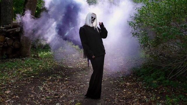 Dead bride is dancing in the middle of the forest.