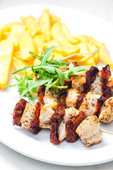 skewers with dry tomatoes and poultry meat