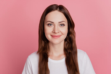 Obraz premium Portrait of positive cheerful adorable lovely girl look camera smile on pink background