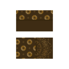 Brown business card with Greek gold pattern for your brand.