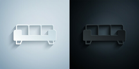 Paper cut Sofa icon isolated on grey and black background. Paper art style. Vector