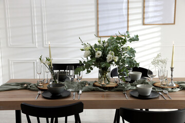 Festive table setting with beautiful tableware and decor indoors