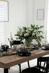 Festive table setting with beautiful tableware and decor indoors