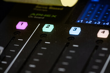 Audio Mixer detail with button and knobs for audio mixing and editing. Workstation for audio and...